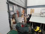 a room with a table, chairs, and other items in it