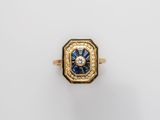 an 18k gold and sapphire ring with diamonds
