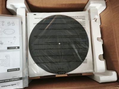 une photo d'un disque dans une boîte sur laquelle figurent des instructions