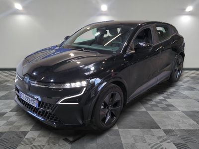 the black car is parked on a checkered floor in the garage