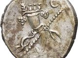 a close up of a silver coin with a bird on it