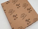 the box is made of cardboard and has a pattern of triangles on it