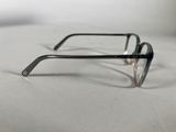 a pair of glasses sitting on a white surface