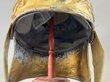a helmet that is sitting on top of a wooden stand