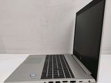 an open laptop computer sitting on top of a white table