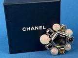 a close up of a black box with a ring on top of it