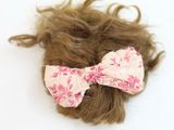 a hair with a bow tie on top of it