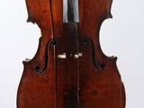 a close up of a violin on a stand against a white background
