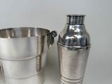 two silver cups sitting next to each other on a table