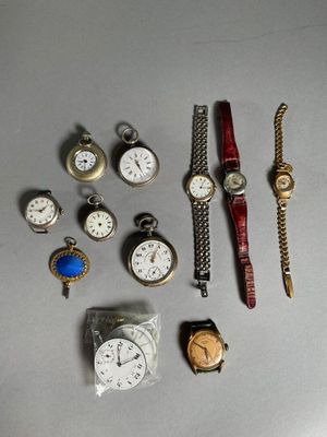 a lot of watches that are sitting on a table