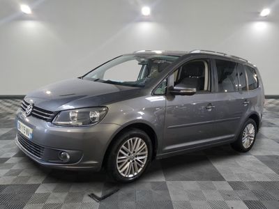 the grey van is parked in the garage on a checkered floor