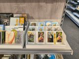 many religious cards displayed on a shelf in a store