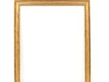 a gold frame on a white wall with a white background