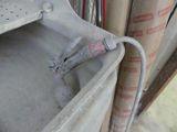 a metal shelf that has a hose attached to it