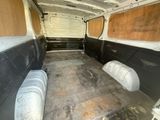 a white van that has a lot of seats in the back of it