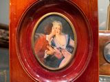 a picture of a woman holding a baby in a picture frame