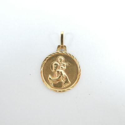 une image représentant une pièce d'or sur laquelle figure une femme tenant un enfant dans ses bras