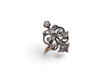 a close up of a ring on a white surface