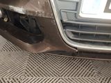 a car that has been dented and is parked on the side of the road