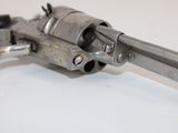 a gun that is sitting on top of a table