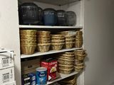many baskets on the shelves in the pantry