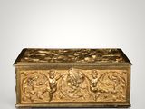 a gold box with a design of angels and flowers on it