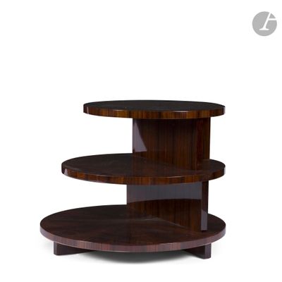 the three tiered table is made of wood and has a circular base