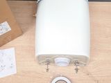 a white toilet sitting on top of a wooden table