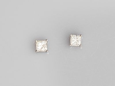 a pair of princess cut diamond stud earrings