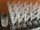 a lot of wine glasses sitting on a table
