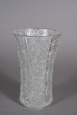 pair of cut glass vases with floral designs on the sides