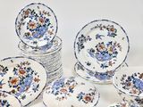 a lot of plates that are sitting on a table
