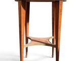 a small wooden table with a drawer on top of it