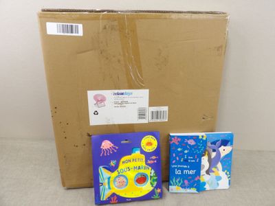 two books that are sitting next to a cardboard box