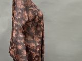 an image of a mannequin mannequin wearing a brown and black patterned top