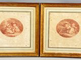 two framed prints of a woman and a child