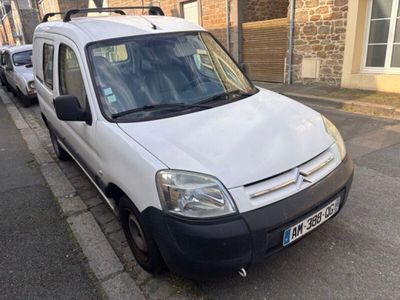 a white van that is parked on the side of the street
