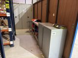 a refrigerator that is sitting in the middle of a room