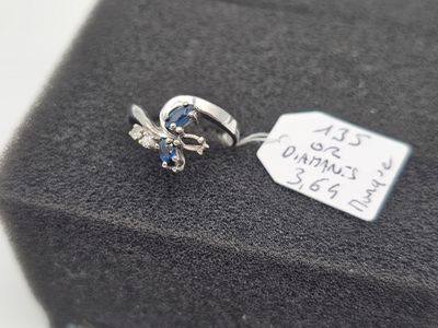 a ring that is sitting on top of a black cloth