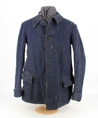 an image of a blue coat on a mannequin stand