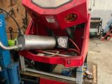 a picture of a machine that is sitting in a garage
