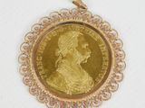 an image of a gold coin with a woman ' s face on it