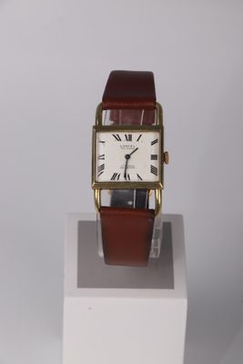 a small square watch with roman numerals on the face