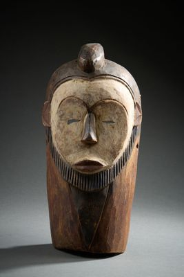an image of a wooden sculpture of a man with a beard