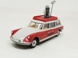 a red and white toy car with a man on top of it