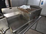 a large metal grill with a lot of rust on it
