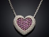 a heart shaped pink sapphire and diamond pendant on a chain