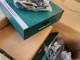 a green box with a green cover and a black box with a green cover and a black box with a green cover and a green box with a black