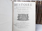 an old book with a picture of a woman on it