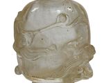 a glass vase with a face on it on a white surface